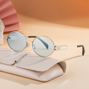 Vintage oval silver metal sunglasses with light blue lenses and cream soft pouch