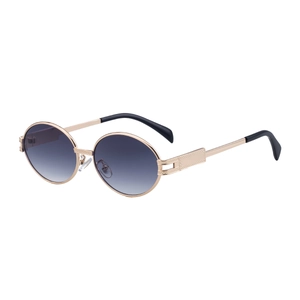 Vintage oval sunglasses with gold metal frame and gradient lenses for a stylish look