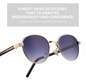 Detail of gold metal oval sunglasses with purple gradient lenses and fine frame structure