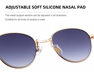Detail of adjustable soft silicone nose pads on gold metal sunglasses frame