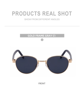 Front view of oval sunglasses featuring a gold metal frame and dark gray lenses