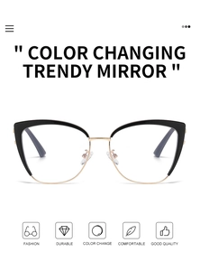 Detail of cat-eye photochromic glasses showing black and gold frame and nose pads