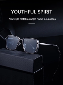 Close-up of gunmetal square sunglasses with light blue lenses and textured folding case