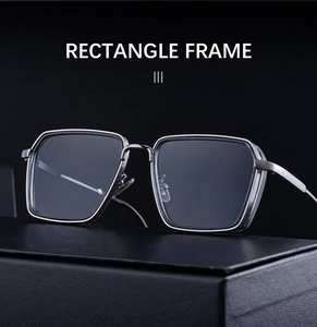 Macro shot of stylish rectangular sunglasses on textured black display case with metal detail