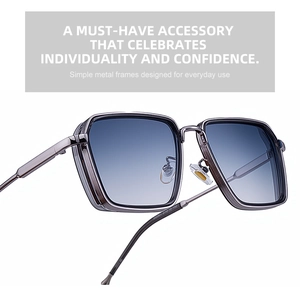Detail of gunmetal frame sunglasses with gradient blue lenses and vintage punk design