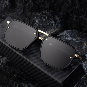 Retro square frame sunglasses for men with gold bridge on a textured black hard case