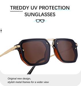 Close-up of square sunglasses with tortoise inner frame and golden metal temples