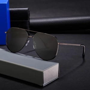 Classic polarized aviator sunglasses for men with a metallic frame on a gray case
