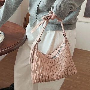 Pink Matelassé pleated leather underarm bag with bow detail and slim shoulder strap
