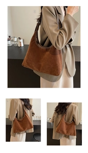Close-up of brown suede hobo bag with smooth leather edges and minimalist branding