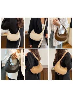 Showcase of textured lychee pattern half-moon bags in white, brown, black, and beige colors