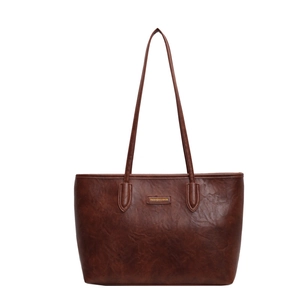 Minimalist large vintage brown leather tote bag with gold label for daily commuting