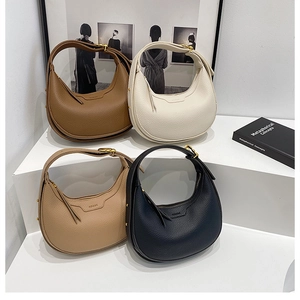 Retro lychee texture hobo bags in four colors displayed on a modern white stepped stand