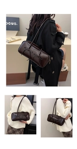 Detail view of espresso underarm bag featuring double bow accents and a retro bowling style