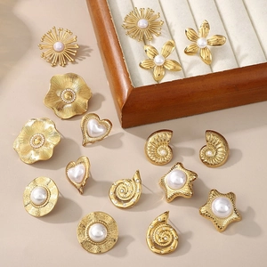 Golden sea shell and star stud earrings set with pearls and diamonds for women