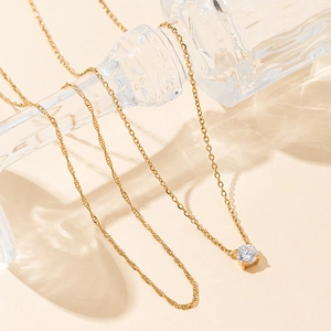 Minimalist gold plated stainless steel layered necklace with zircon pendant on glass bottle