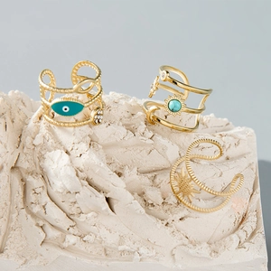 Three-piece adjustable stainless steel rings set with Evil Eye and sun motifs in gold