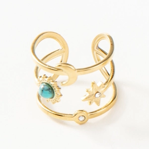 Detail of gold multi-layer adjustable ring with moon, star and turquoise sun charm