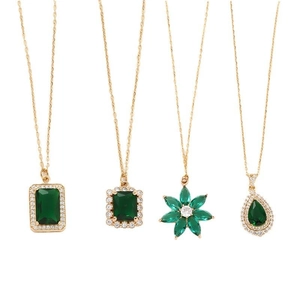 Set of four gold geometric crystal necklaces with green emerald pendants for women
