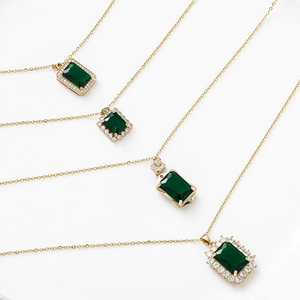 Vintage emerald green pendant necklaces with gold plating and cubic zirconia accents