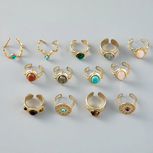 Set of 13 vintage gold-tone adjustable rings with turquoise and colorful natural stones