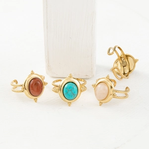 Set of four gold-plated vintage rings with colorful natural stones and beaded texture