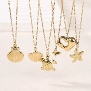 Gold hollow heart and sea turtle pendant necklaces set in polished stainless steel finish