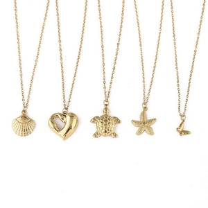 Detailed set of 18K gold plated stainless steel necklaces featuring turtle and shell charms