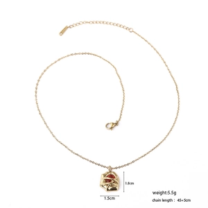 Detail of 18k gold plated titanium necklace with red stone pendant and size measurements