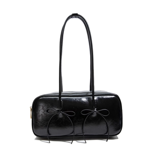 Retro black patent leather underarm bowling bag with elegant double bow decorations