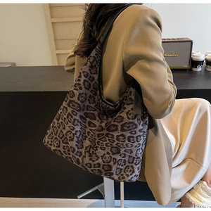 Fashionable large leopard print tote bag styled over the shoulder with an autumn outfit