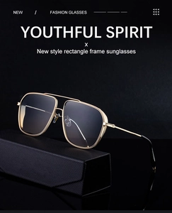 Detail of gold metal frame rectangle sunglasses with gradient lenses and double bridge