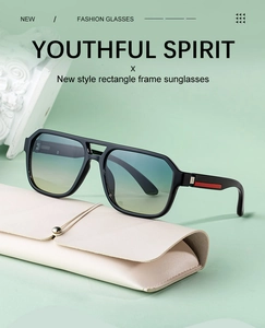 Rectangle frame sunglasses with gradient lenses and a beige leather case on a green background
