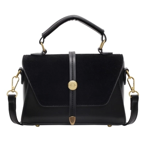 Minimalist black dual-texture handbag with gold ring buckle on white background
