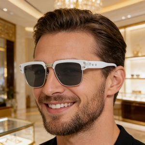 Close-up of white acetate square frame sunglasses on male model in luxury setting