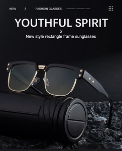 Detail of square polarized sunglasses featuring black acetate and gold metal frames