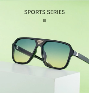 Detail of square polarized sunglasses with gradient lenses and gold bridge accents