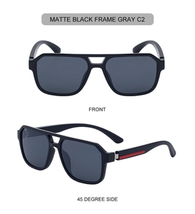 Detail view of matte black double-bridge sunglasses with gray lenses and red stripe accents