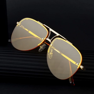 Classic pilot semi-rimless sunglasses with gold metal frame and yellow tinted lenses