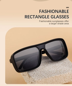 Fashionable rectangle sunglasses with black frame on white stone for a stylish look