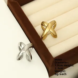 Detailed view of hollow geometric X-shaped rings with size and weight dimensions