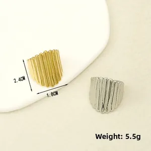 Detail of wide vertical stripe rings in gold and silver finish with dimensions