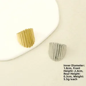 Detail view of 18k gold and silver hammered rings showing width and diameter dimensions