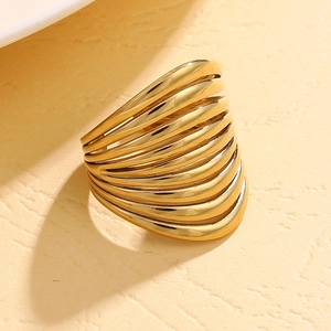 Detailed macro view of 14K gold-plated hollow multi-layer wavy wide statement ring