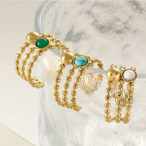 Three-piece layered titanium steel ring set with emerald, turquoise, and marble stones
