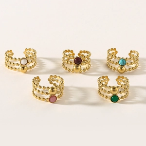 Close-up of five-piece set adjustable gold beaded rings with assorted colorful gemstones