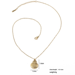 Detail of 18k gold scallop shell pendant with fine cross chain and extension