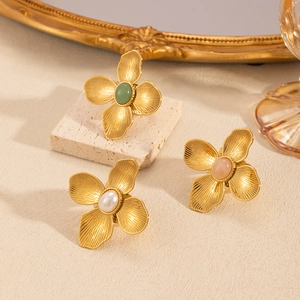 Vintage gold flower rings with colorful natural stones and textured petal engraving