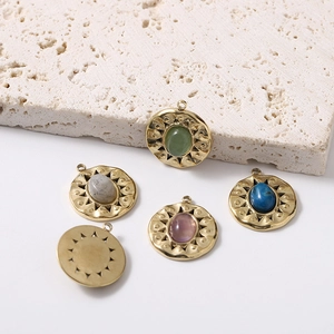 Golden sunburst natural stone pendants set on white travertine stone backdrop