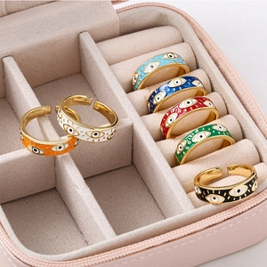 Minimalist gold plated evil eye open rings with colorful enamel in a velvet jewelry box